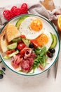 Healthy breakfast with oatmeal, berries, egg, bacon and a cup of coffee. Good morning Royalty Free Stock Photo