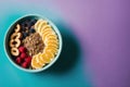 Healthy breakfast. Oatmeal with berries and nuts in a blue bowl on a colorful background. Generative AI Royalty Free Stock Photo