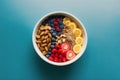 Healthy breakfast. Oatmeal with berries and nuts in a blue bowl on a colorful background. Generative AI Royalty Free Stock Photo