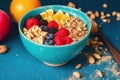 Healthy breakfast. Oatmeal with berries and nuts in a blue bowl on a colorful background. Generative AI Royalty Free Stock Photo