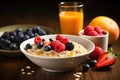 Healthy breakfast with oatmeal, berries and orange juice on wooden table, Chia seed pudding with strawberries, blueberries and Royalty Free Stock Photo