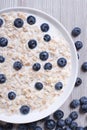 Healthy breakfast of oatmeal with blueberries and milk top view Royalty Free Stock Photo