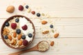 healthy breakfast. oatmeal, blueberries, raspberries and nuts on white wooden table. Top view with copy space Royalty Free Stock Photo