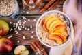 Healthy breakfast: oatmeal bowl with caramelized apples, cinnamon and honey Royalty Free Stock Photo