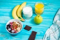 Healthy Breakfast - Oatmeal with fruits, milk and juice at blue Royalty Free Stock Photo