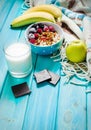 Healthy Breakfast - Oatmeal with fruits, milk and juice at blue Royalty Free Stock Photo