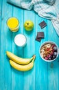 Healthy Breakfast - Oatmeal with fruits, milk and juice at blue table. Royalty Free Stock Photo