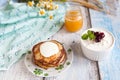 Healthy breakfast with oatmeal pancakes, beaded cheese and honey Royalty Free Stock Photo