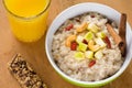 Healthy breakfast, oatmeal porridge with fruits, nuts and juice Royalty Free Stock Photo