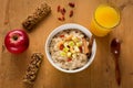 Healthy breakfast, oatmeal porridge with fruits, nuts and juice Royalty Free Stock Photo