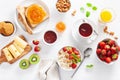 Healthy breakfast with oatmeal porridge, strawberry, nuts, toast, jam and tea. Top view Royalty Free Stock Photo