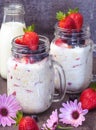 Healthy breakfast overnight oats with fresh berry in mason jar