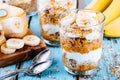 Healthy breakfast parfait. homemade granola with natural yogurt, banana and caramel sauce Royalty Free Stock Photo