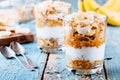 Healthy breakfast parfait. homemade granola with natural yogurt, banana and caramel sauce Royalty Free Stock Photo