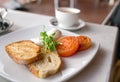 Healthy breakfast with poached eggs, tomatoes and toast bread Royalty Free Stock Photo