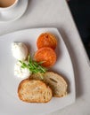 Healthy breakfast with poached eggs, tomatoes and toast bread. Top view