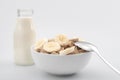 Healthy breakfast and rich  source of calcium and fiber concept with generic shredded wheat cereal and banana slices, bottle of Royalty Free Stock Photo