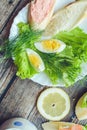 Healthy breakfast, sandwiches coffee salad eggs on dark wooden background. Plate food green vegetarian Royalty Free Stock Photo