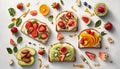 Healthy breakfast with sandwiches and fruits on light background, top view
