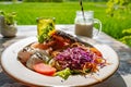 Healthy breakfast served on a vintage table with an emerald green rice field background. Concept of a healthy food and healthy Royalty Free Stock Photo