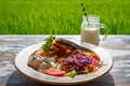 Healthy breakfast served on a vintage table with an emerald green rice field background. Concept of a healthy food and healthy Royalty Free Stock Photo