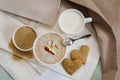 Healthy breakfast. Sesame dry cookies in the form of heart porridge of amaranth with apples and yogurt