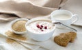 Healthy breakfast. Sesame dry cookies in the form of heart, porridge of amaranth with strawberries and yogurt