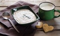 Healthy breakfast. Sesame dry cookies in the form of heart porridge of amaranth and yogurt