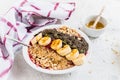 Smoothie bowl with blueberries, banana, oat flakes, chia seeds, quinoa, pumpkin seeds and honey Royalty Free Stock Photo