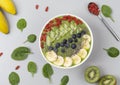 Healthy breakfast smoothie bowl topped with blueberry, kiwi, banana, spinach, Chia seeds and Goji berries. Detox concept. Royalty Free Stock Photo