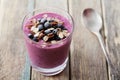 Healthy breakfast of smoothie, dessert, yogurt or milkshake with frozen berry and oats decorated grated chocolate