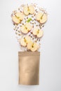 Healthy breakfast and snack concept. Top view of granola ingredients fall into paper bag on white background Royalty Free Stock Photo