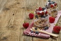 Healthy breakfast of strawberry parfait with fresh fruit, yoghurt and muesli at a  wooden table. Royalty Free Stock Photo