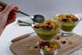 Healthy breakfast, summer dessert with smoothie kiwi, corn flakes and dried fruits Royalty Free Stock Photo