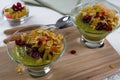 Healthy breakfast, summer dessert with smoothie kiwi, corn flakes and dried fruits Royalty Free Stock Photo
