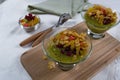 Healthy breakfast, summer dessert with smoothie kiwi, corn flakes and dried fruits Royalty Free Stock Photo