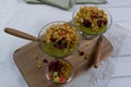 Healthy breakfast, summer dessert with smoothie kiwi, corn flakes and dried fruits in a glassware Royalty Free Stock Photo