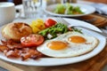 Healthy breakfast table scene with fruit, yogurts, oatmeal, smoothie, nutritious toasts and egg skillet. Top view over a wood Royalty Free Stock Photo