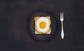 Healthy breakfast toasts with avocado and fried egg on the black stone background flat lay mock-up with copy space Royalty Free Stock Photo
