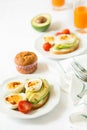 Healthy breakfast: toasts with avocado slices, tomato, paprika and eggs Royalty Free Stock Photo