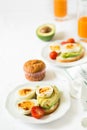 Healthy breakfast: toasts with avocado slices, tomato, paprika and eggs Royalty Free Stock Photo