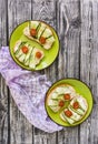 Healthy breakfast, toasts with cucumber and tomatoes sprinkled with dry herbs and spices, diet food, on a dark background.