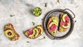 Healthy breakfast toasts from sliced watermelon radish and avocado. banner, catering menu recipe place for text, top view