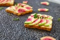 Healthy breakfast toasts from sliced watermelon radish Royalty Free Stock Photo