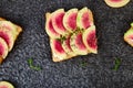 Healthy breakfast toasts from sliced watermelon radish Royalty Free Stock Photo