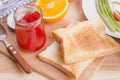 Healthy breakfast with toasts and strawberry jam, on table Royalty Free Stock Photo