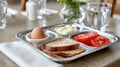Healthy breakfast tray with egg, toast, tomatoes, and cottage cheese. Royalty Free Stock Photo