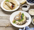 Healthy breakfast trend. Thin oat pancakes with banana, blueberries, goji berries, sesame and chia seeds