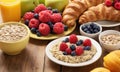 Healthy breakfast. Vibrant photo of table full of fresh fruit, oatmeal and healthy croissants. Balanced diet. Royalty Free Stock Photo