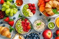 Healthy breakfast. Vibrant photo of table full of fresh fruit, oatmeal and healthy croissants. Balanced diet. Royalty Free Stock Photo